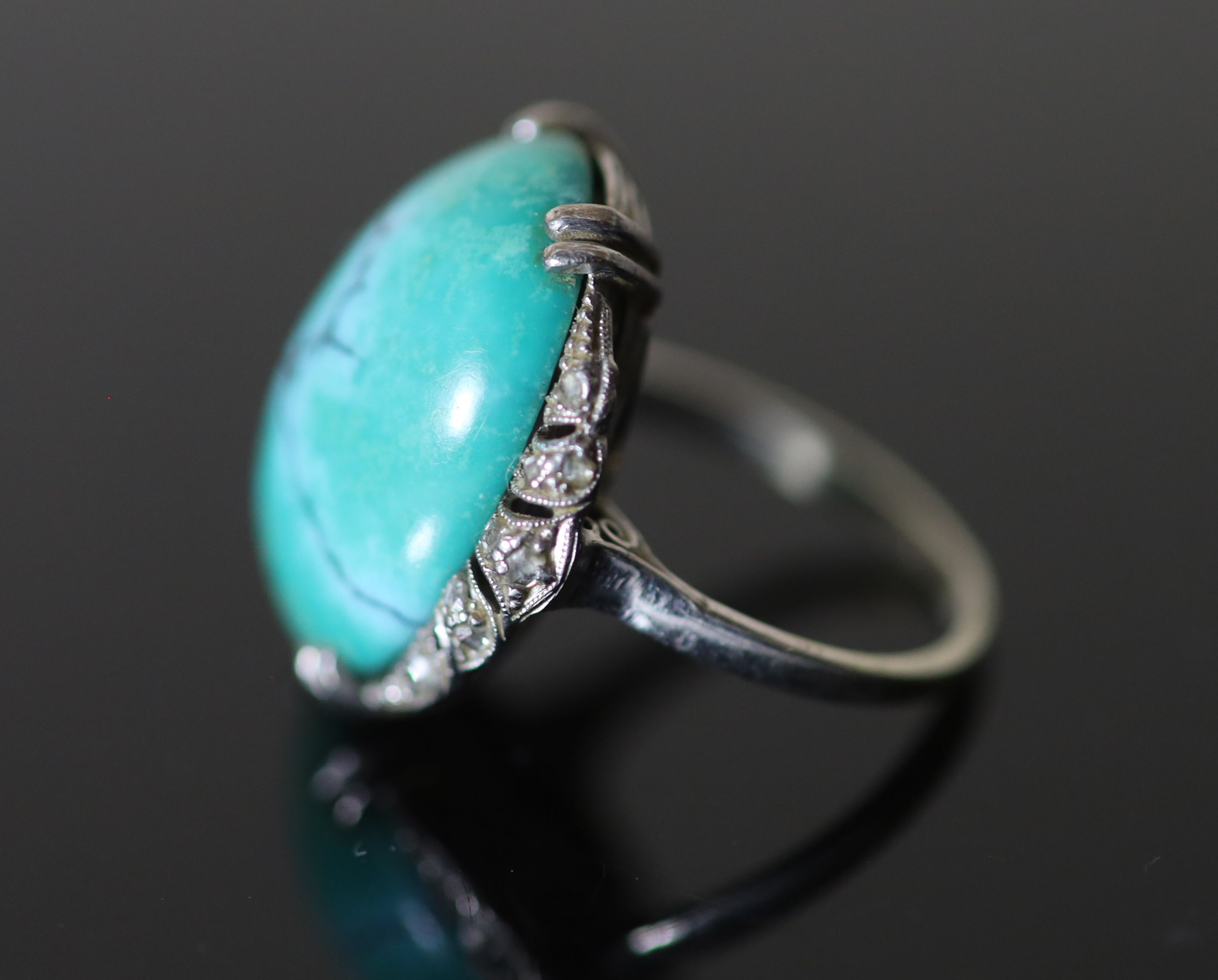 A 20th century 18k white gold, cabochon turquoise and rose cut diamond chip set oval dress ring,